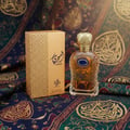 Afnan 9PM by Afnan 100ml EDP Men — Fragrance bottle with apples, limes, and cinnamon sticks inside, on a wooden table.