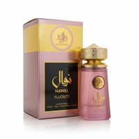 Al Wataniah Nawal Fluorite — Pink glass perfume bottle with gold cap next to its pink and gold box.