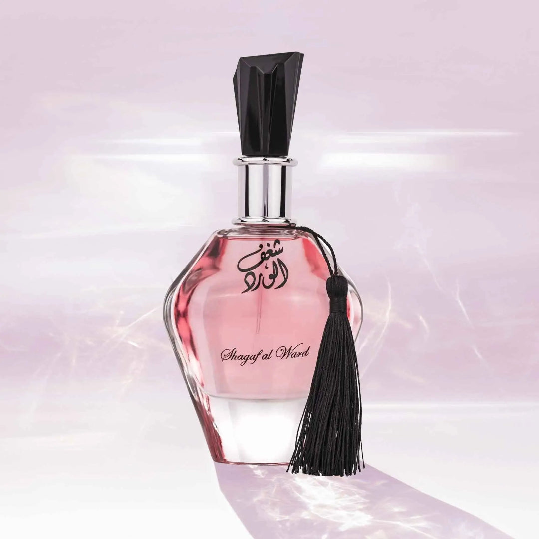 Al Wataniah Amnia by Al Wataniah For Her 100ml EDP — Glass bottle with gold accents and Arabic text, next to a drawstring