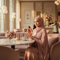 Al Wataniah Eqaab by Al Wataniah Elite 100 ml for Men — Perfume bottle and box with eagle emblem in front of Petronas Towers