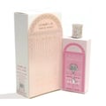 Al Wataniah Nawal Fluorite — Pink glass perfume bottle with gold cap next to its pink and gold box.