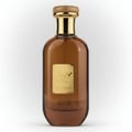 Ard Al Zaafaran Bint Hooran — Black glass perfume bottle with gold Arabic script, black bow, and faceted cap on white
