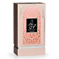 Al Wataniah Tiara – Red gradient glass perfume bottle with gold textured cap and gold Arabic script.