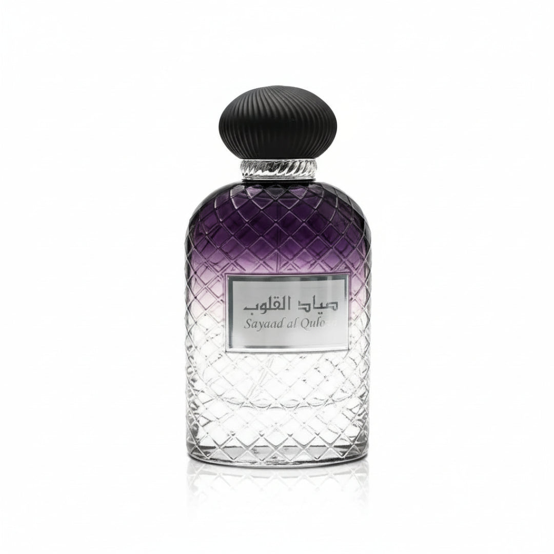 Ard Al Zaafaran Jazzab Silver – Silver ornate cage bottle with green liquid, diamond-shaped emblem with Arabic script and