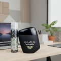 Al Wataniah Sabah Al Ward — A gradient purple and black glass perfume bottle with gold accents and a crystal cap, set