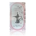Al Wataniah Shagaf Al Ward — Clear glass perfume bottle with peach liquid, black tassel, and Arabic script on white