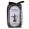 Al Wataniah Selena — Pink glass perfume bottle with ornate silver cap next to a pink marble patterned box.