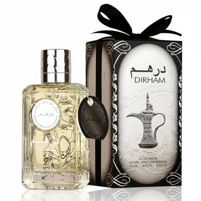 Ard Al Zaafaran Dirham By Ard Al Zaafaran Perfume For Him 100ml — Clear glass perfume bottle with ornate design next to a