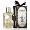 Al Wataniah Selena — Pink fluted glass perfume bottle with ornate silver cap next to its marble-patterned box.