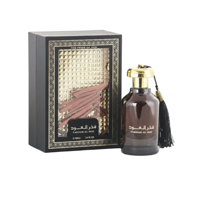 Ard Al Zaafaran Fakhar Al Oud – Black box with gold accents and oud sticks, next to a dark glass bottle with gold cap and