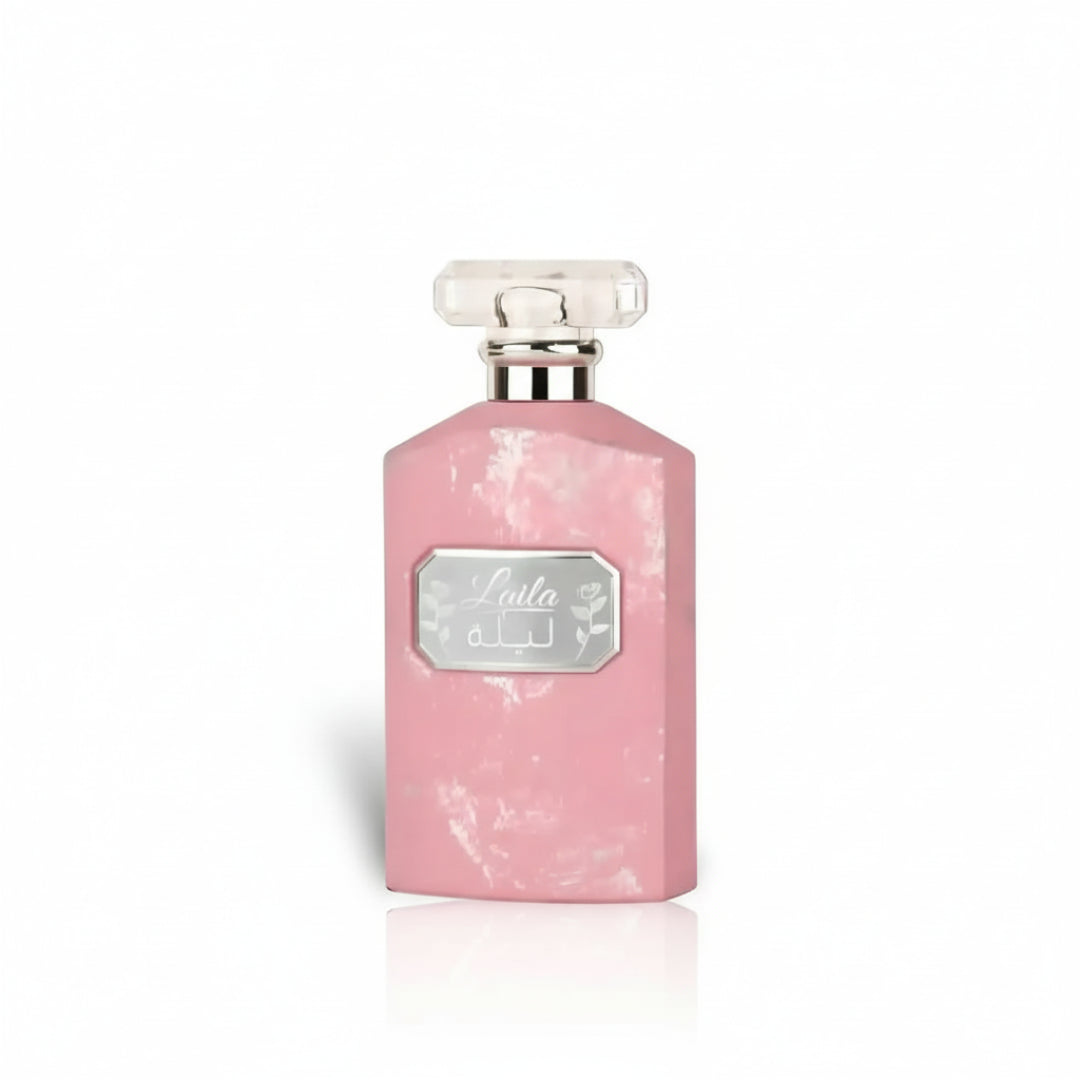 Ard Al Zaafaran Ajmal Ehsas Bloom — Pink glass perfume bottle with a faceted crystal cap and a decorative silver charm.
