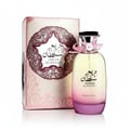 Al Wataniah Tiara Pink — Pink glass perfume bottle with a gold textured cap and Arabic script.