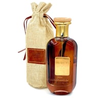 Ard Al Zaafaran Mousuf by Ard Al Zaafaran EDP 100 ml — Amber glass bottle with gold cap and wooden accent, beside a burlap