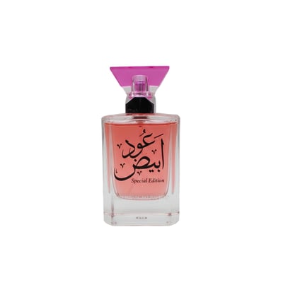 Ard Al Zaafaran Oud Abyad — Clear glass perfume bottle with pink liquid, Arabic script, and a pink geometric cap.