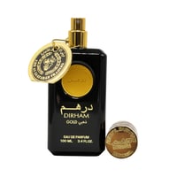 Ard Al Zaafaran Dirham Gold — Black perfume bottle with gold accents, gold tag, and detached gold cap.