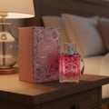 Ard Al Zaafaran Hooria for Her — Perfume bottle and box displayed on a car seat next to a quilted handbag.