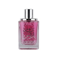 Ard Al Zaafaran Rose Paris — Clear glass perfume bottle with pink liquid, silver cap, and ornate Arabic script design.