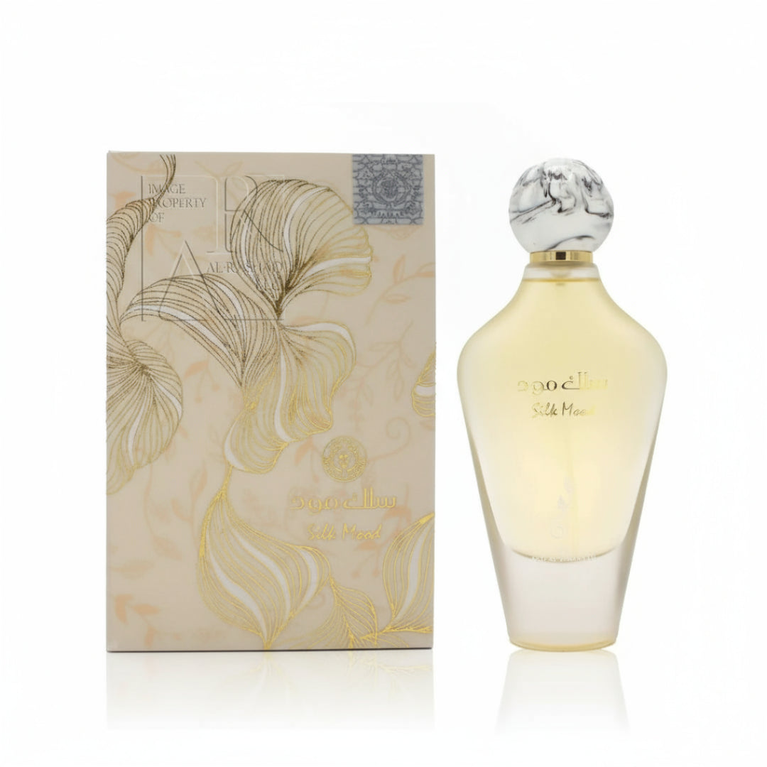 Ard Al Zaafaran Maraseem Al Malaki — Clear glass perfume bottle with a grey label featuring a giraffe-like pattern and