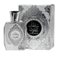 Ard Al Zaafaran Sultan Al Quloub — Clear glass perfume bottle with silver cap and ornate label next to a silver patterned