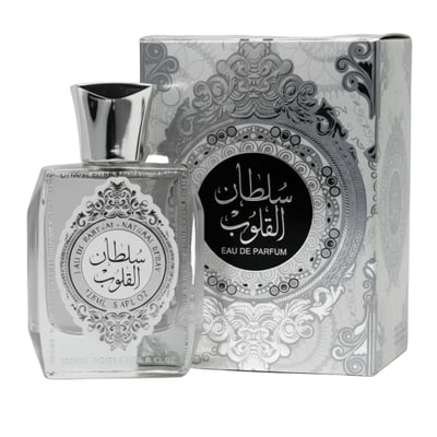 Ard Al Zaafaran Sultan Al Quloub — Clear glass perfume bottle with silver cap and ornate label next to a silver patterned