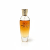 Ard Al Zaafaran Teef Al Hub — Clear glass perfume bottle with gold cap, amber liquid, and Arabic script.