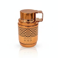 Armaf Aoud Odyssey — Copper-toned perfume bottle with intricate black geometric pattern and a hinged handle on the cap