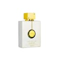 Ard Al Zaafaran Safeer Al Oud — Amber liquid in a clear glass bottle with a gold crown cap and ornate gold detailing on the