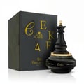 Ard Al Zaafaran Sayaad Al Quloob – Blue patterned box with gold mandala design next to a clear glass perfume bottle with