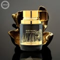 Armaf King Checkmate 100ml EDP — Black chess king bottle next to a dumbbell in a gym