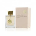 Ard Al Zaafaran Zahoor Francee — Pink box and glass perfume bottle with black fabric wrap and silver cap, Arabic script on