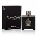 Armaf Club de Nuit Iconic 10ml EDP — Blue cylindrical packaging and a matching travel spray bottle with silver accents and
