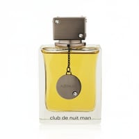 Armaf Club De Nuit Man — Black box with white circle and text next to a clear glass bottle of golden liquid with a silver tag