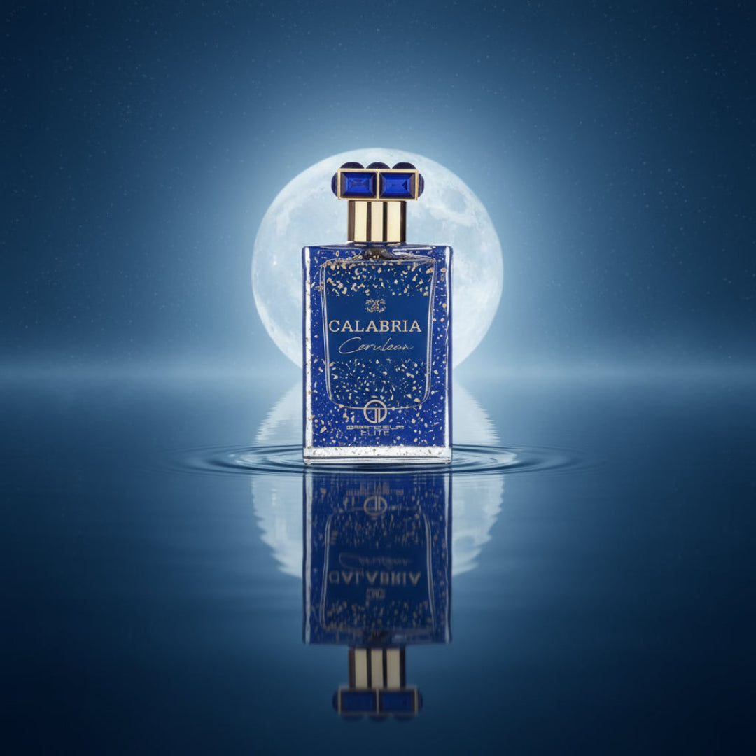 Blue speckled perfume bottle with gold accents and a keychain on a white background