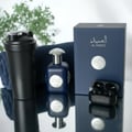 Armaf Connoisseur Man by Armaf — Black perfume box and bottle on car dashboard with city skyline at night