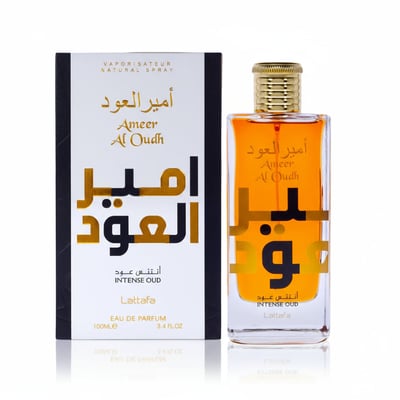 Lattafa Ameer Al Oudh Intense EDP 100ml — A clear glass perfume bottle with orange liquid and gold cap, next to its white