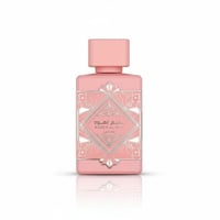 Lattafa Badee Al Oud Noble Blush — Pink perfume bottle with ornate silver geometric label and pink cap, isolated on white.