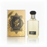 Lattafa Golden Oud — A gold and black patterned box sits next to a clear glass perfume bottle with a black ribbed cap.