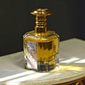 Lattafa Al Nashama Caprice — Blue glass perfume bottle with ornate gold and black marbled cap, set against a warm, textured