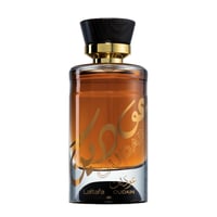 Lattafa Oudain oleh Lattafa Perfumes 100ml EDP untuk Lelaki — Cecair amber dalam botol kaca jernih dengan kaligrafi Arab emas dan teks 'Lattafa OUDain' di pangkal, bertudung penutup kayu hitam dan kolar emas.