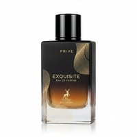 Maison Alhambra Exquisite Prive — Black and gold rectangular perfume bottle with a gradient amber liquid, featuring a deer logo and ornate gold patterns.