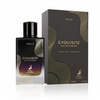 Maison Alhambra Exquisite Prive Eau de Parfum — Black bottle with gold accents and a gradient of purple to clear liquid, next to its matching black and gold patterned box.