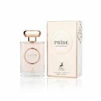 Maison Alhambra Pride by Maison Alhambra 100ml EDP Women — A clear glass perfume bottle with a rose gold cap and a circular label featuring the word 'PRIDE' in gold, placed next to its matching rose gold and white box.