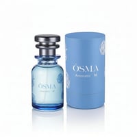 Osma Aromatic M Essence of Nature 75ml — Blue glass perfume bottle with silver cap and blue cylindrical box with rose motifs, displayed on a white reflective surface.