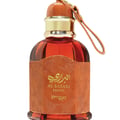 Lattafa Badee Al Oud Noble Blush — Pink perfume bottle with ornate silver geometric label and pink cap, isolated on white.