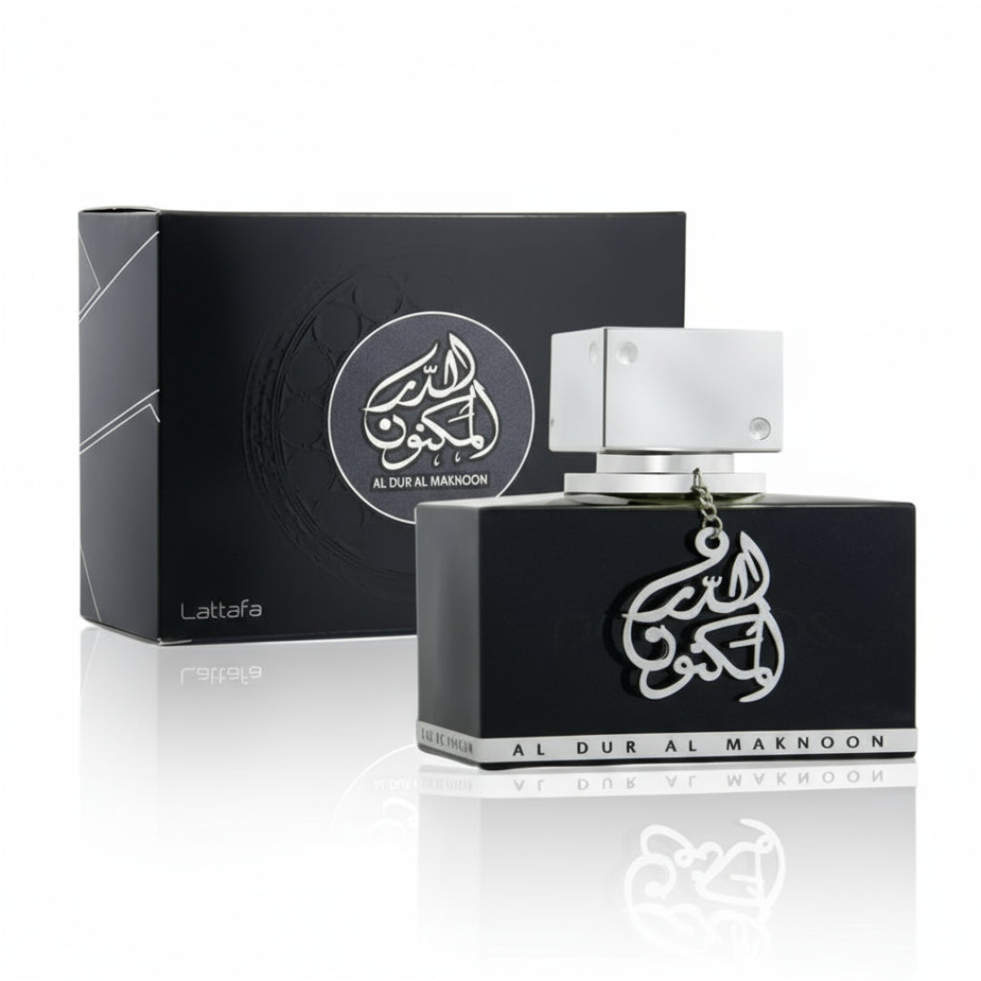 Perfume bottle and packaging of Al Dur Al Maknoon by Lattafa on a white background