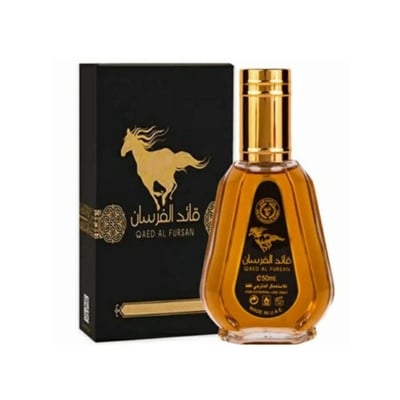 Ard Al Zaafaran Qaed Al Fursan by Ard Al Zaafaran 50ml — A black perfume box with a golden horse silhouette and Arabic text stands next to a clear glass perfume bottle with golden accents and similar branding. | Ard Al Zaafaran Qaed Al Fursan by Ard Al Zaafaran 50ml — Kotak minyak wangi hitam dengan siluet kuda emas
