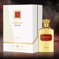 Asdaaf Sa'ud by Asdaaf 100ml EDP Unisex — Gold perfume bottle and white box with gold accents, featuring Arabic script and a red textured square emblem.