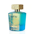 Lattafa Sheikh Al Shuyukh Supreme — A blue gradient glass perfume bottle with a textured gold cap and Arabic calligraphy design | Lattafa Sheikh Al Shuyukh Supreme — Botol minyak wangi kaca gradien biru dengan penutup emas bertekstur dan reka bentuk kaligrafi Arab