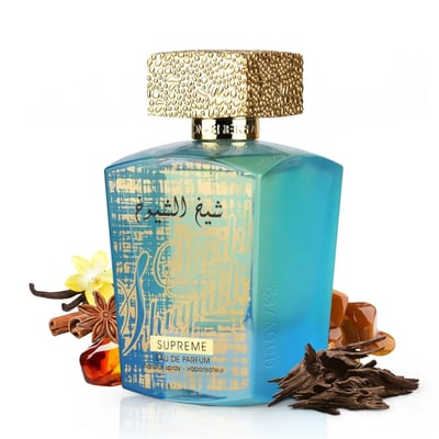 Lattafa Sheikh Al Shuyukh Supreme — A turquoise and gold patterned perfume bottle with a textured gold cap, surrounded by vanilla, star anise, cinnamon, amber resin, caramel, and oud wood chips. | Lattafa Sheikh Al Shuyukh Supreme — Botol minyak wangi corak biru-turkuois dan emas dengan penutup emas bertekstur