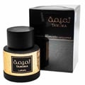 Lattafa Tamima — Black perfume bottle with gold label and black cap, next to a black product box with gold text. | Lattafa Tamima — Botol minyak wangi hitam dengan label emas dan penutup hitam, bersebelahan dengan kotak produk hitam dengan teks emas.